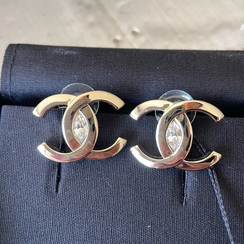 Chanel oversize gold logo earrings with crystal center with box